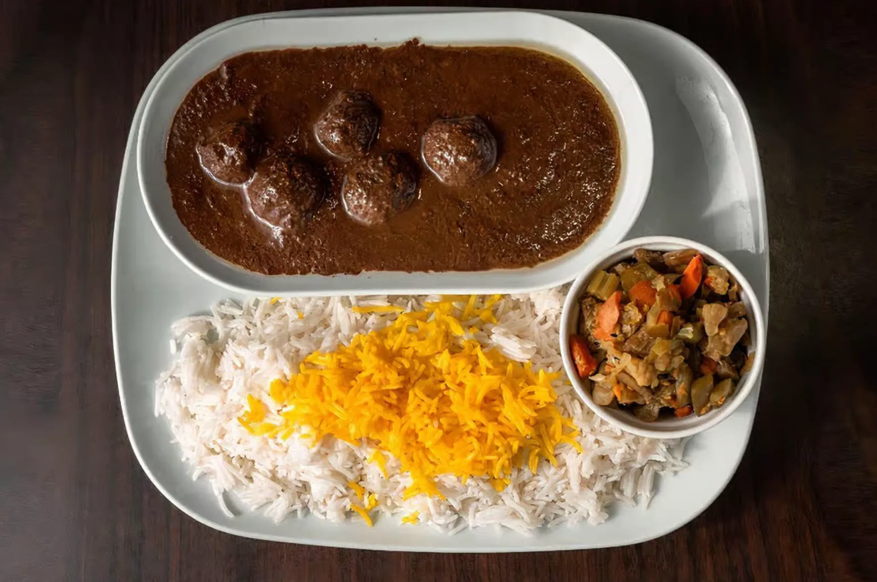 Fesenjan - Persian pomegranate walnut chicken stew at Lotus House Edmonton